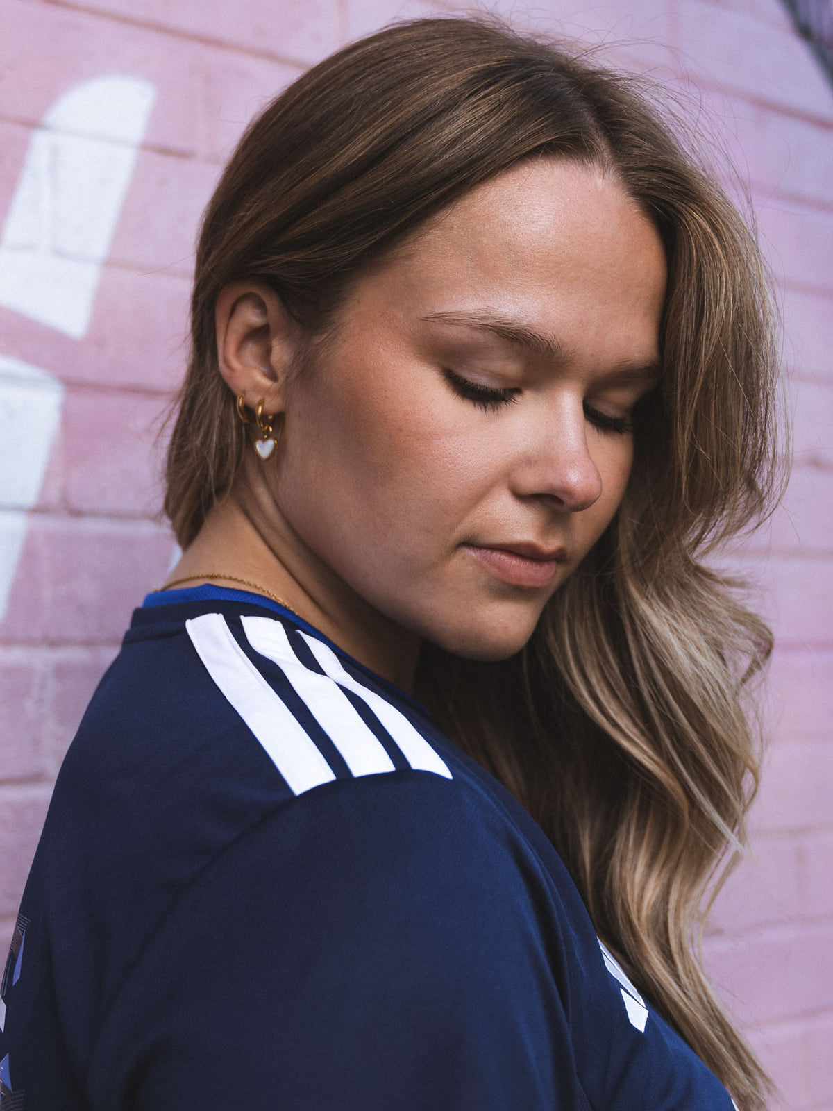 close up view of adidas stripes on adidas Tea Scotland Jersey.