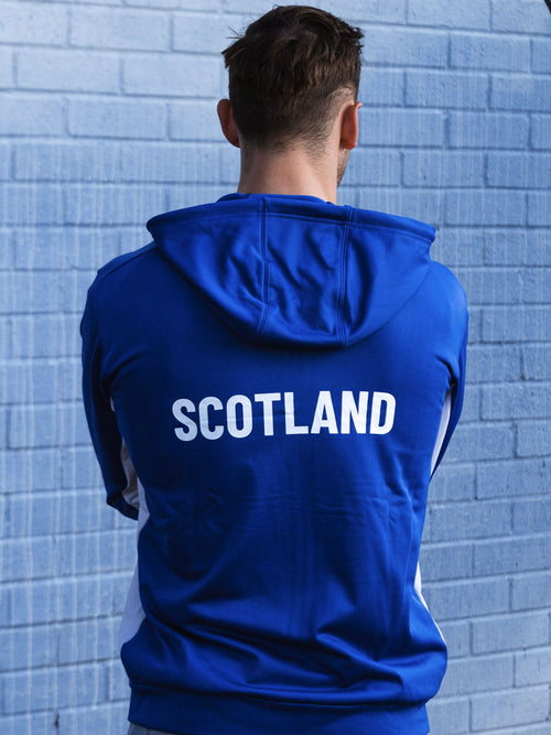 Back view of man wearing royal blue full zip adidas Team Scotland hooded track top.