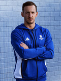 Front view of man wearing royal blue full zip adidas Team Scotland hooded track top.