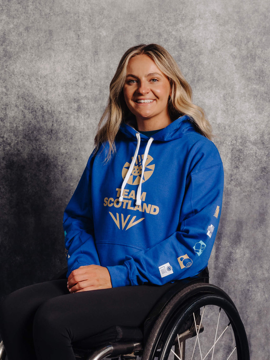 3/4 View Royal Blue G2026 x Team Scotland Contrast Hoodie worn by athlete Melanie Woods