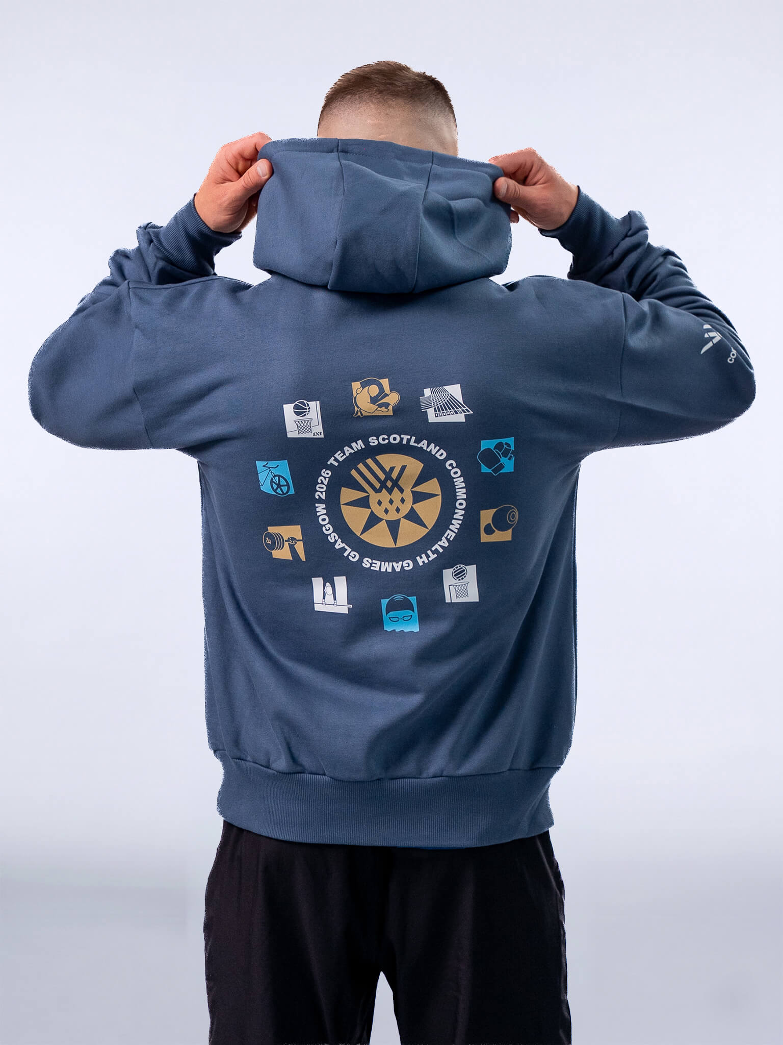 Back view of Atlantic Blue G2026 x Team Scotland Sport Icons Oversized Hoodie worn by athlete Pavel Karnejenko.