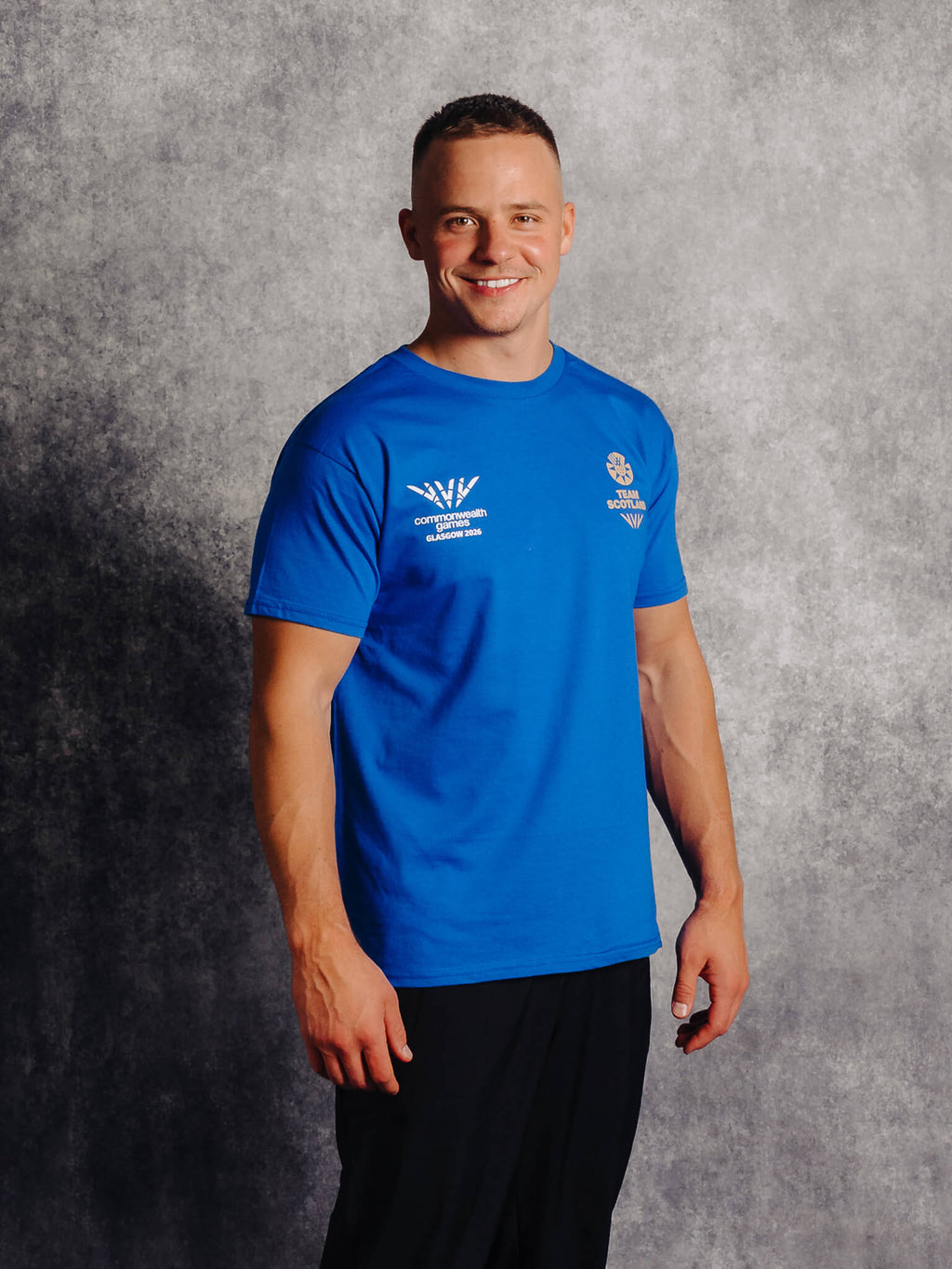 Sde view of Royal G2026 x Team Scotland T-Shirt worn by athlete Pavel Karnejenko