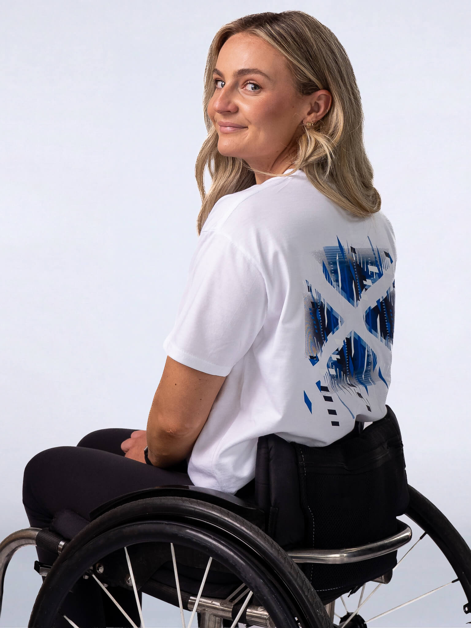 Back view of White G2026 x Team Scotland T-Shirt worn by athlete Melanie Woods