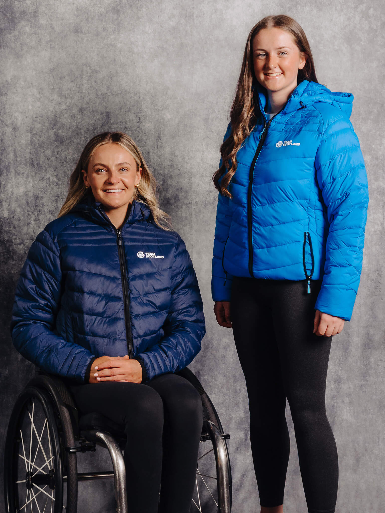 Navy & Ocean Blue Team Scotland Logo Padded Jackets worn by athletes Melanie Woods and Beth Riva