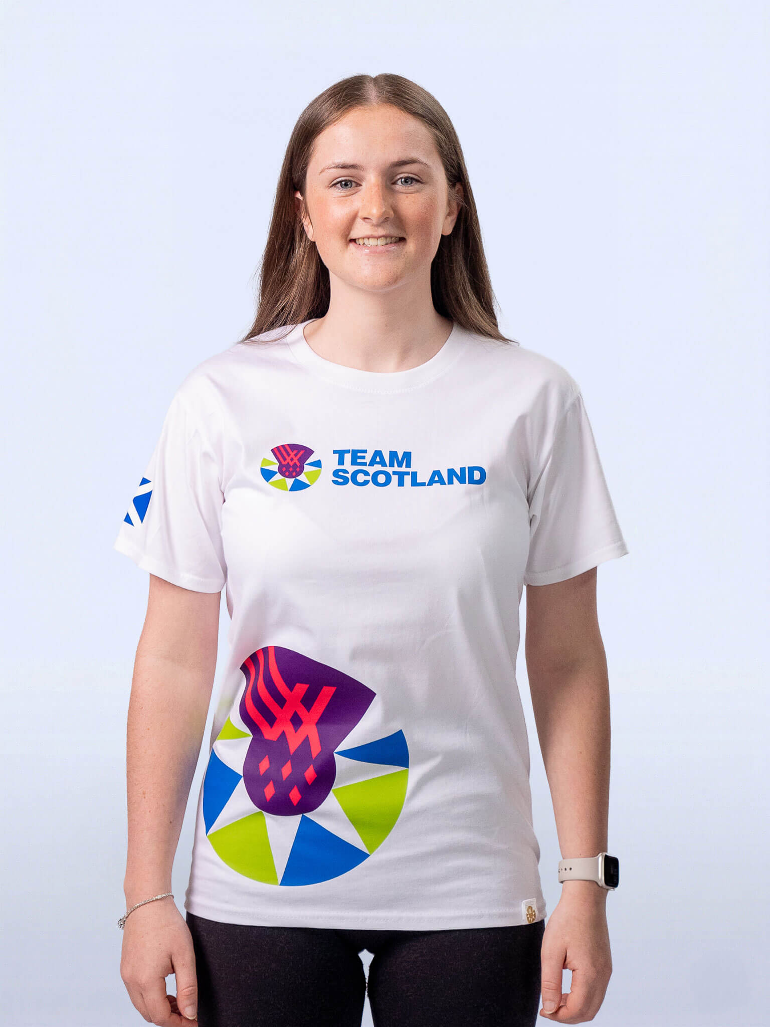 White t-shirt with Team Scotland logo and logomark sideprint worn by athlete Beth Riva